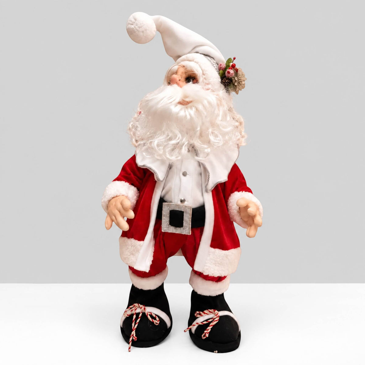 Full front view of handmade Santa Claus in a red suit with a white beard, white hat, and black boots.