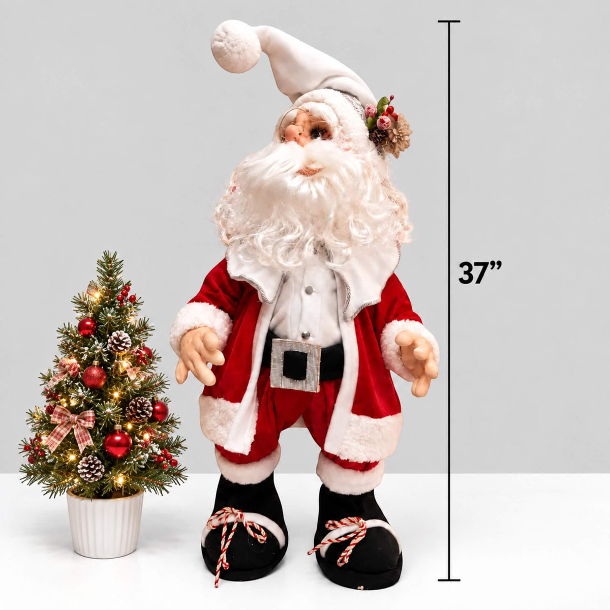 Height comparison of 37-inch Santa Claus beside a smaller decorated Christmas tree.