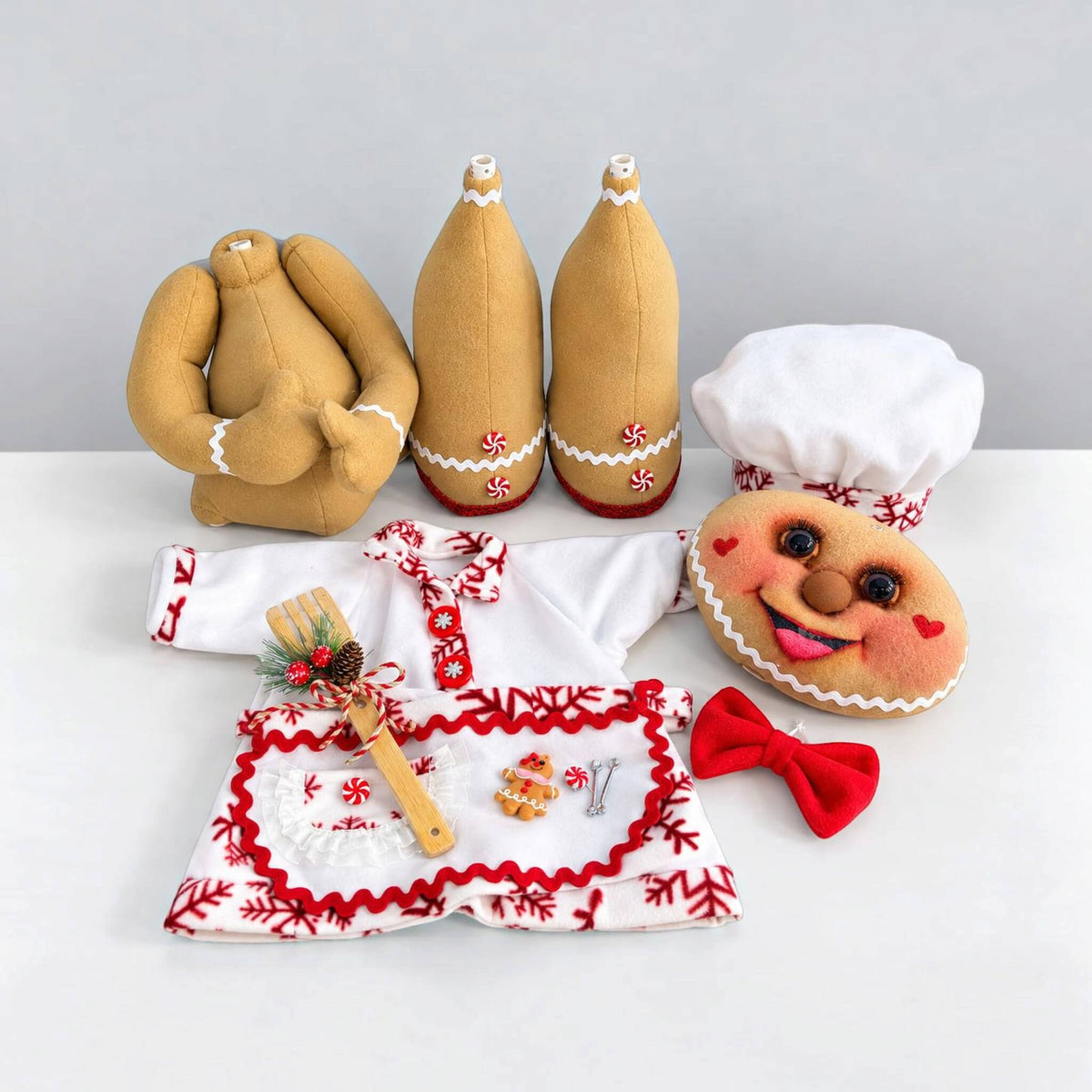 Handmade Christmas Gingerbread Baker disassembled into removable head, torso, and legs with removable chef clothing and accessories for easy storage.
