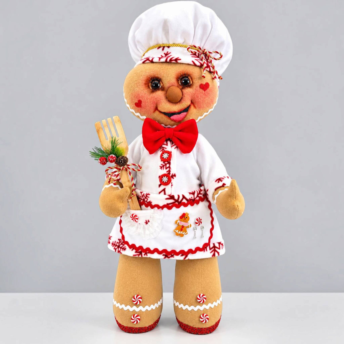 Handmade 35-inch Christmas Gingerbread Baker decoration with chef hat, removable clothing, festive apron, and holiday baking accessory.