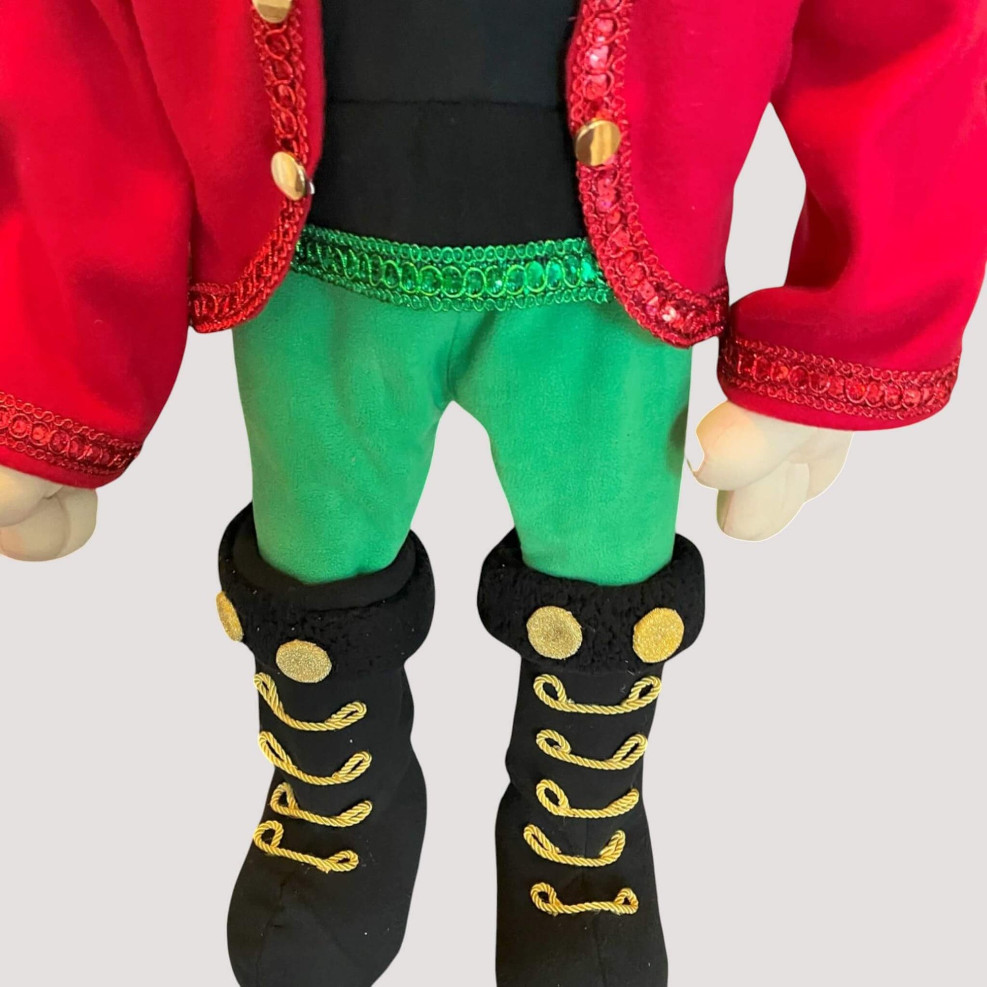 Holiday nutcracker soldier doll with traditional red and gold uniform
