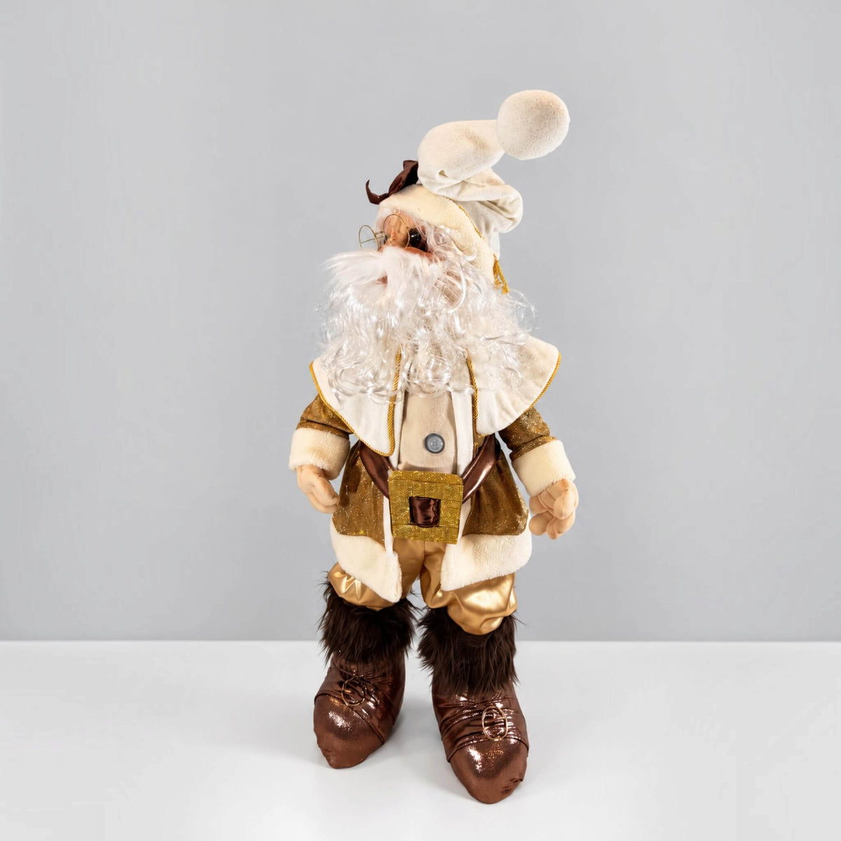 Side view of a handmade Gold Santa Claus Christmas decoration showing his adjustable rotating head, long curly white beard, cream-colored hat, gold coat, articulated fingers, and integrated motion sensor.
