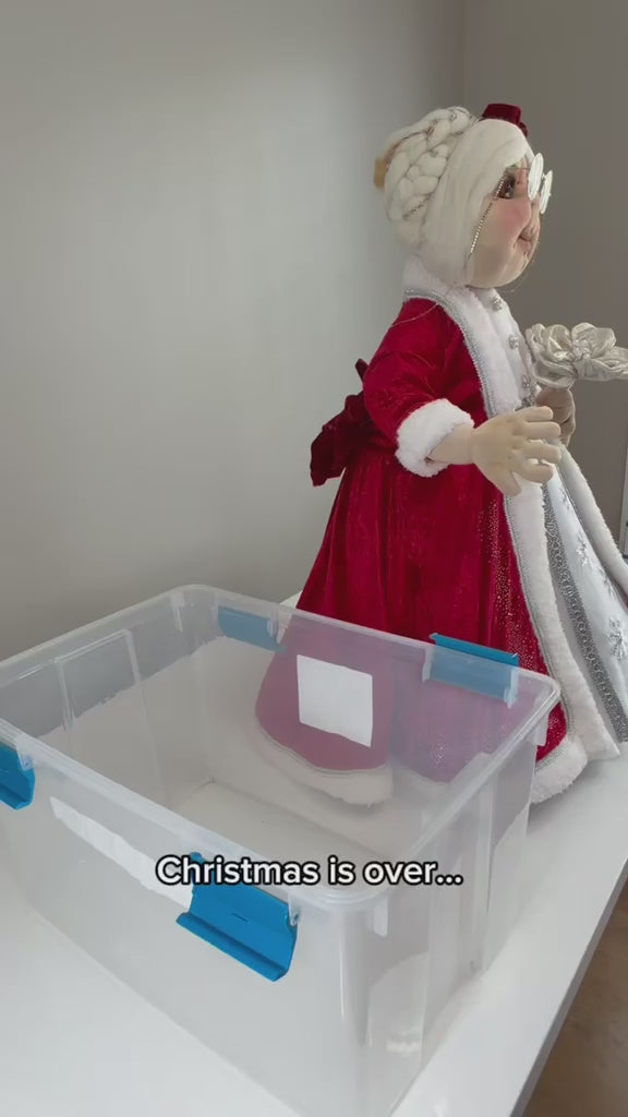 Video demonstrating a handmade Mrs. Claus Christmas decoration with removable head, torso, and legs. Shows the disassembly process, detailed red and white holiday outfit, and how the separate pieces fit into a storage container for convenient seasonal storage.

