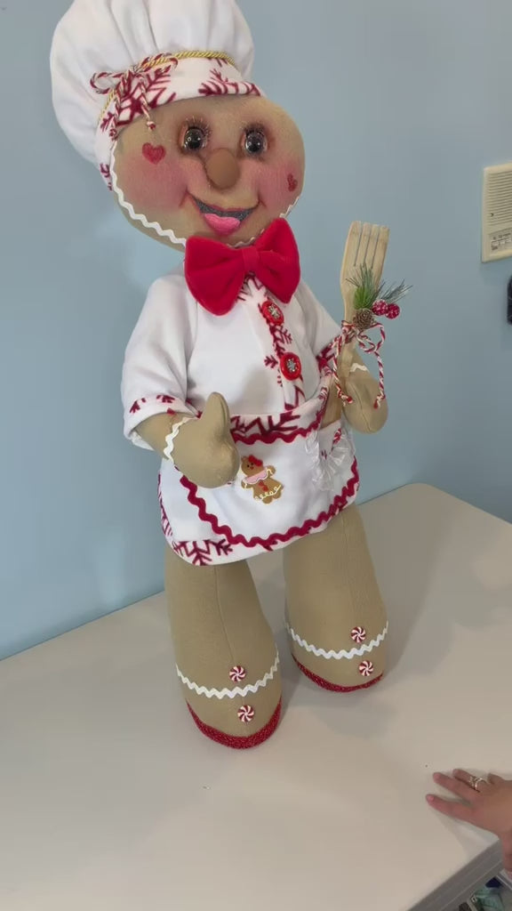 Video demonstrating a handmade 35-inch Gingerbread Baker Christmas decoration by DW Craftworks. Shows the removable head, torso, and legs, detachable chef outfit, and detailed handcrafted accessories. Highlights the easy disassembly and space-saving storage design. Handmade in the USA.

